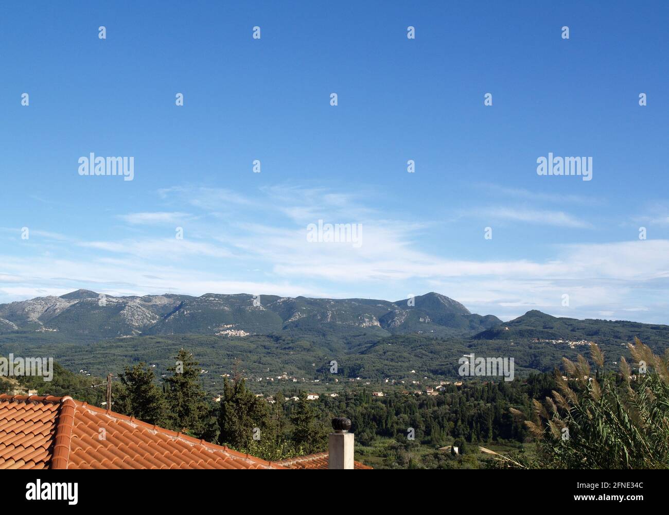Olive groves, hills and mountains taken from Karousades, Corfu, Greece Stock Photo