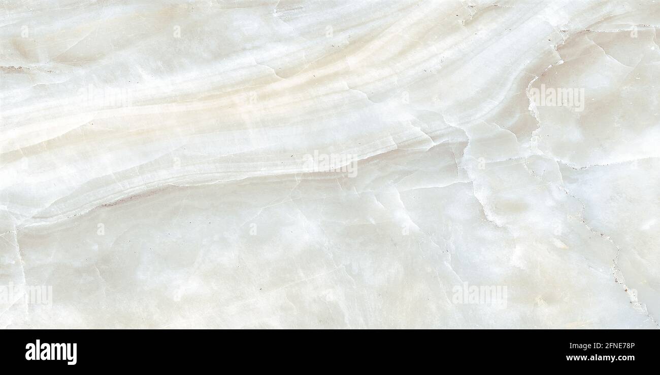 ivory color onyx marble design with natural veins polished finish Stock
