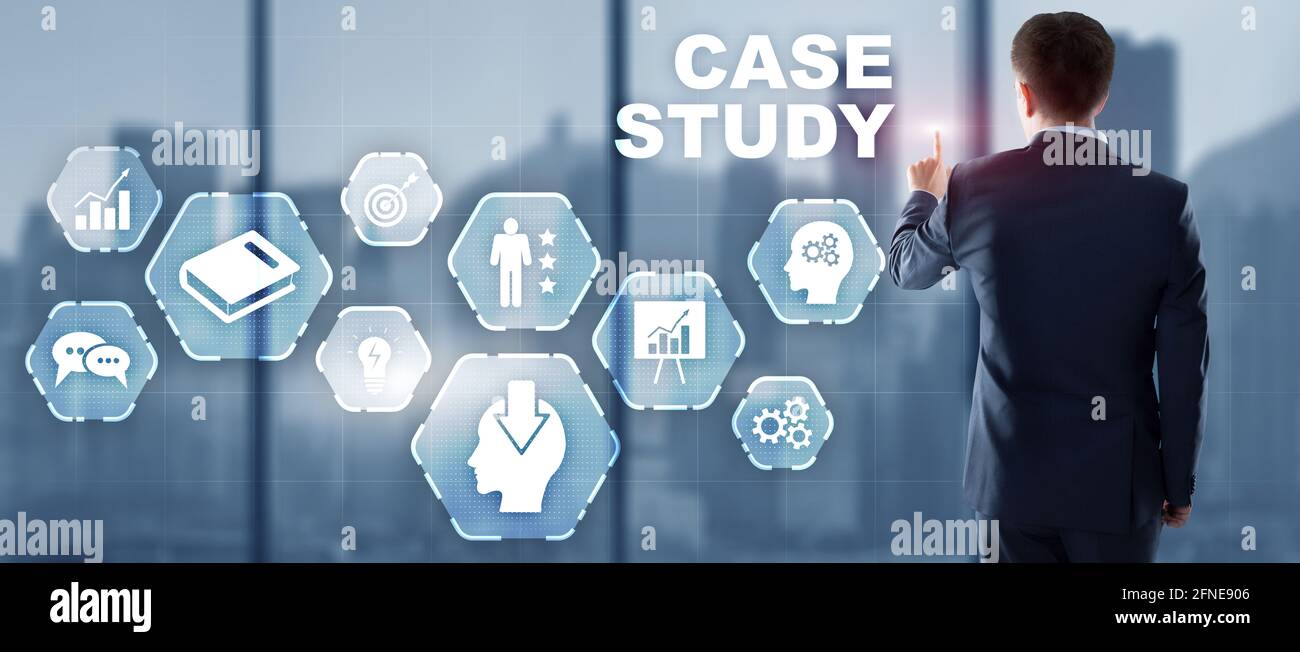 Businessman pressing case study button on virtual screens. Stock Photo