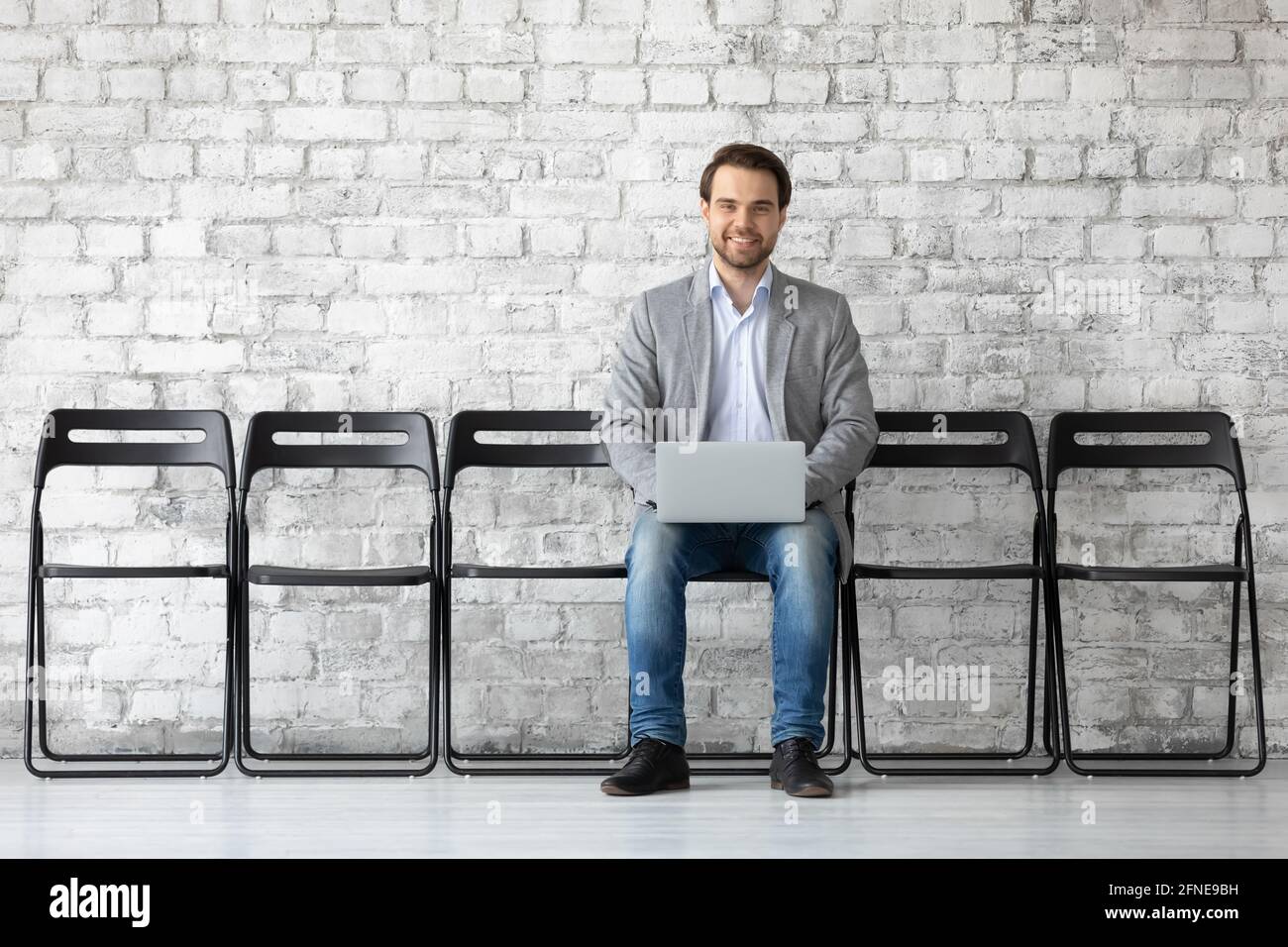 Applicant using laptop, searching vacancy on internet Stock Photo