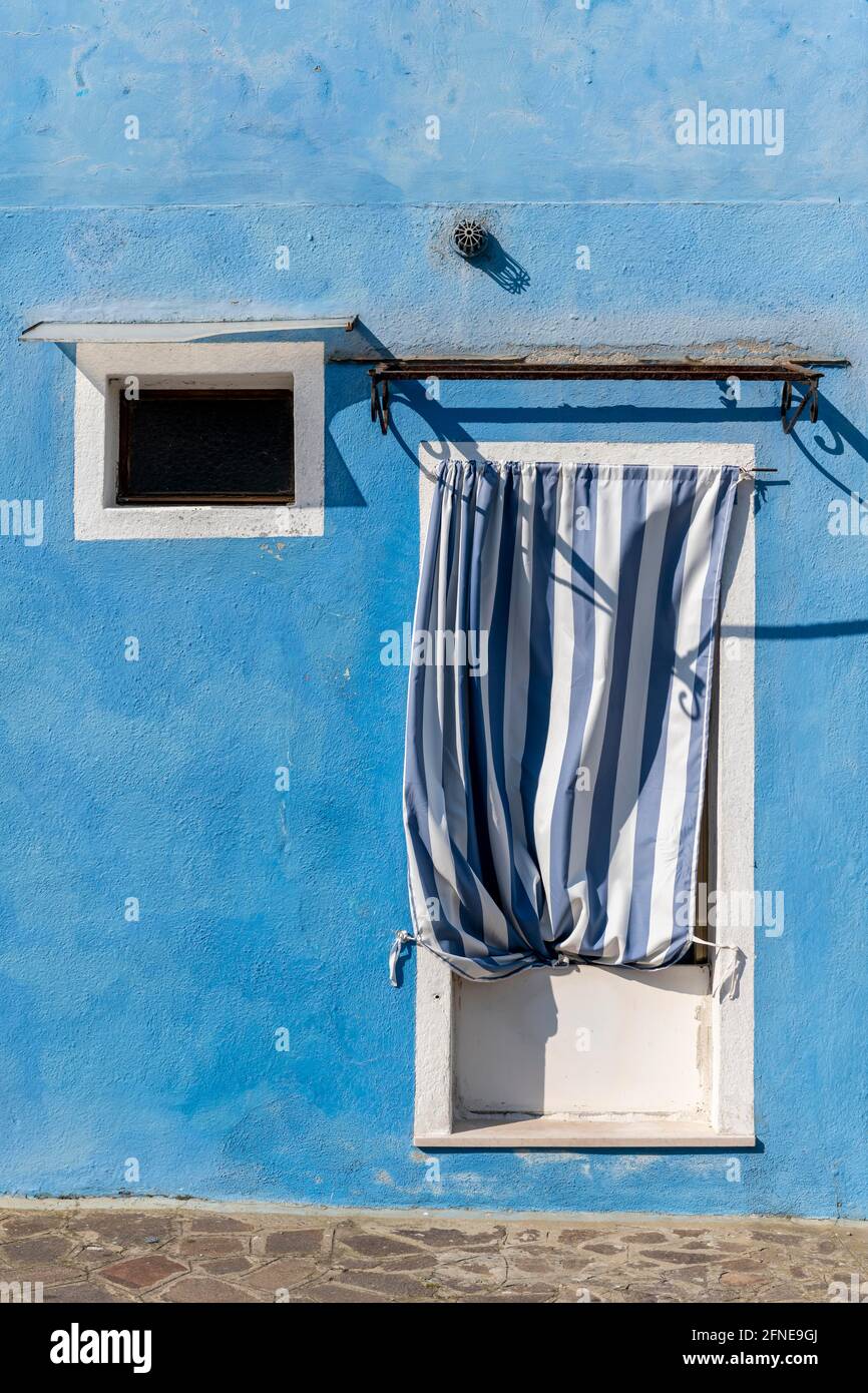 Door and window of a blue house, colorful facade, Burano Island, Venice ...