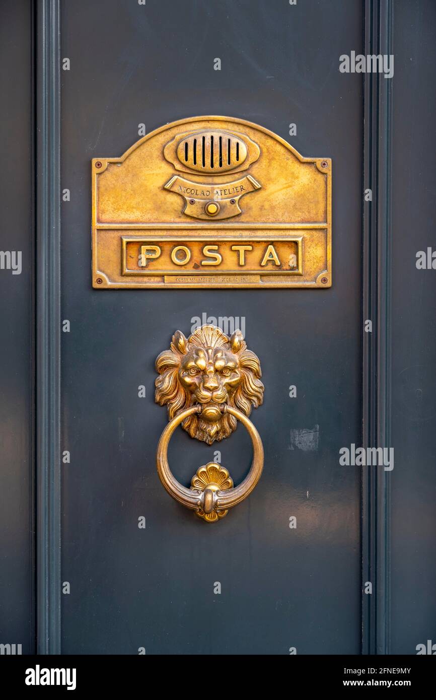 Door knocker in the shape of a lion and letter slot, Venice, Veneto, Italy Stock Photo