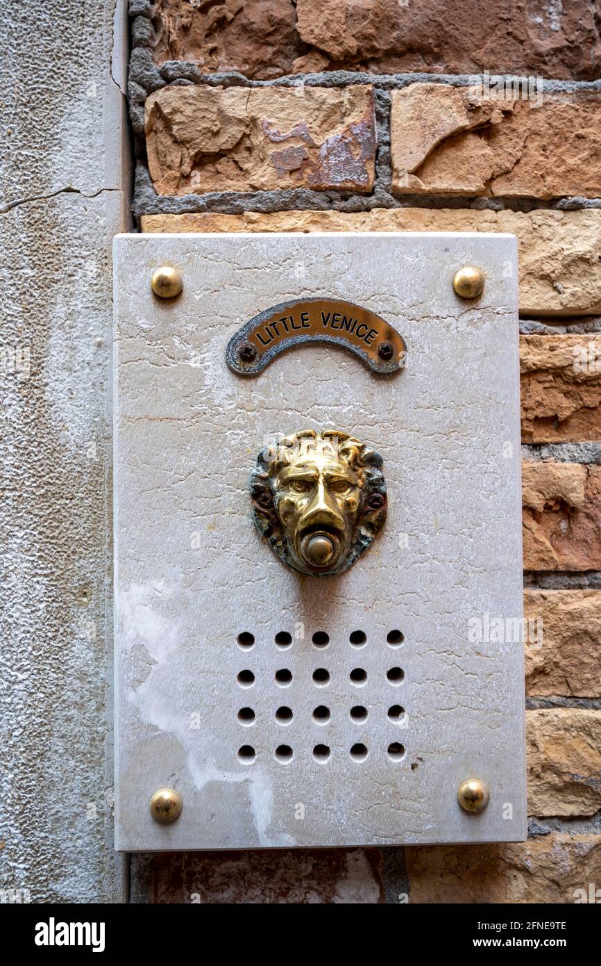 Bell in the shape of a lion on a house wall, Venice, Veneto, Italy Stock Photo