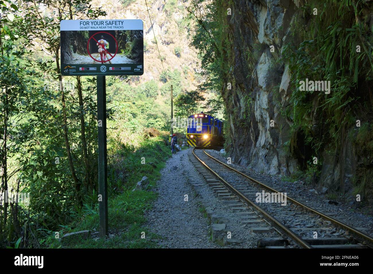 Pedestrian warning sign on the railway line to Cusco, Machu Picchu ...