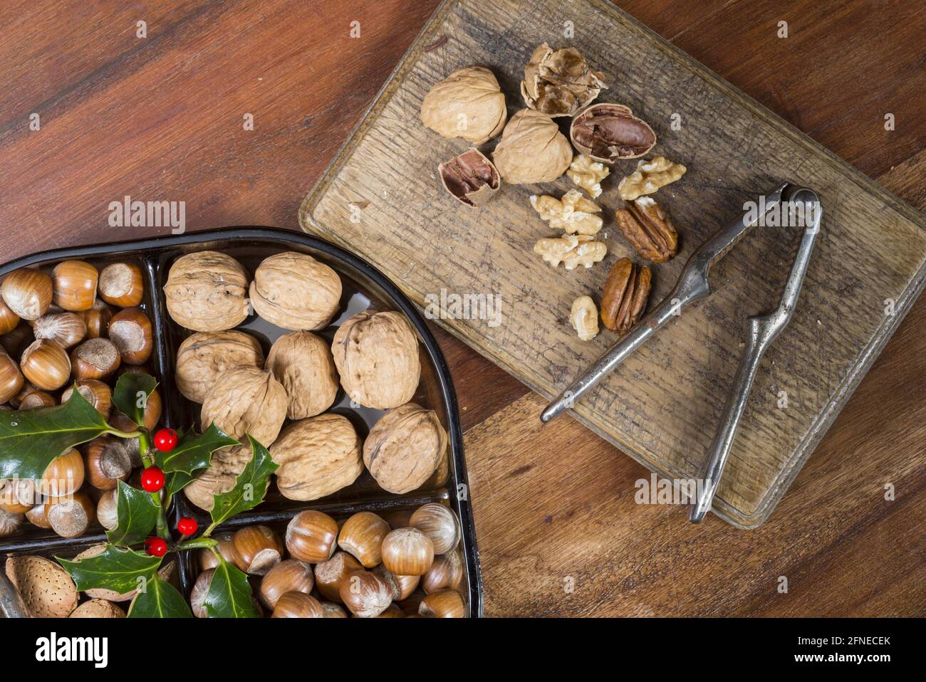 Edible nuts and nutcrackers on table at christmas, England, United