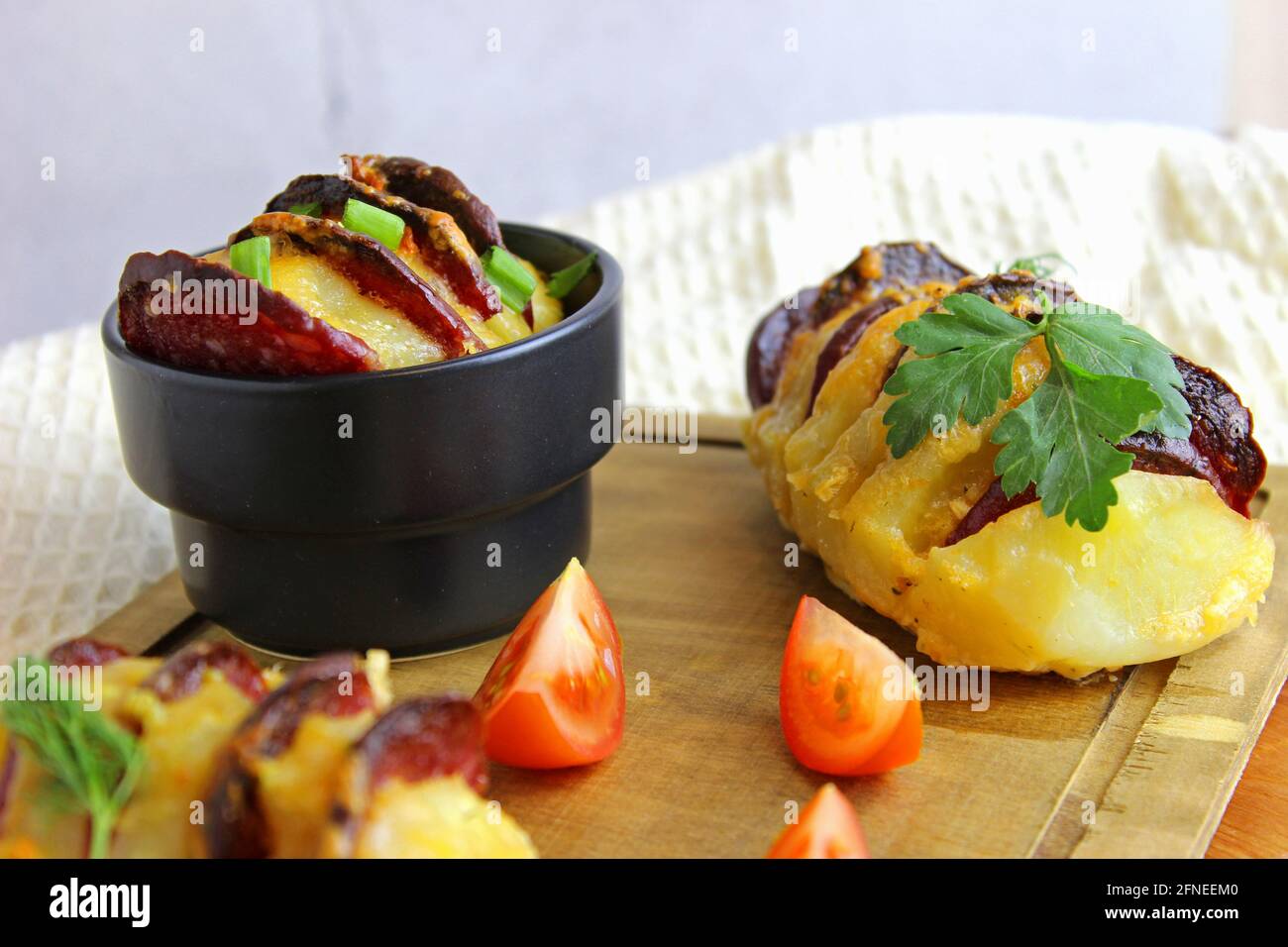 potato stuffed with salami, cheese, ketchup, garlic and herbs. Baked
