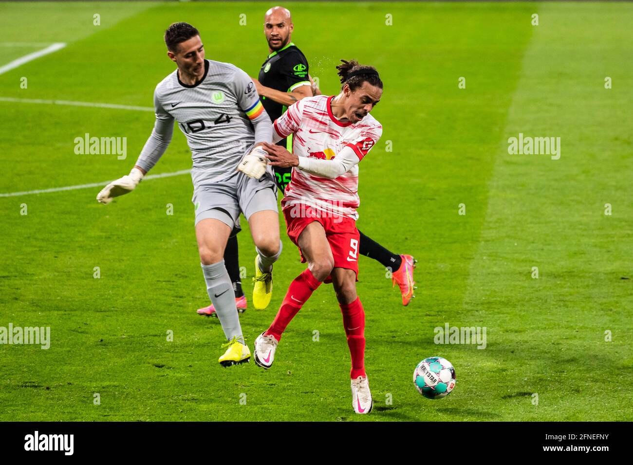 Leipzig, Germany. 16th May, 2021. Yussuf Poulsen (R) of Leipzig vies with goalkeeper Koen Casteels (L) of Wolfsburg during a German Bundesliga match between RB Leipzig and VfL Wolfsburg in Leipzig, Germany, May 16, 2021. Credit: Kevin Voigt/Xinhua/Alamy Live News Stock Photo