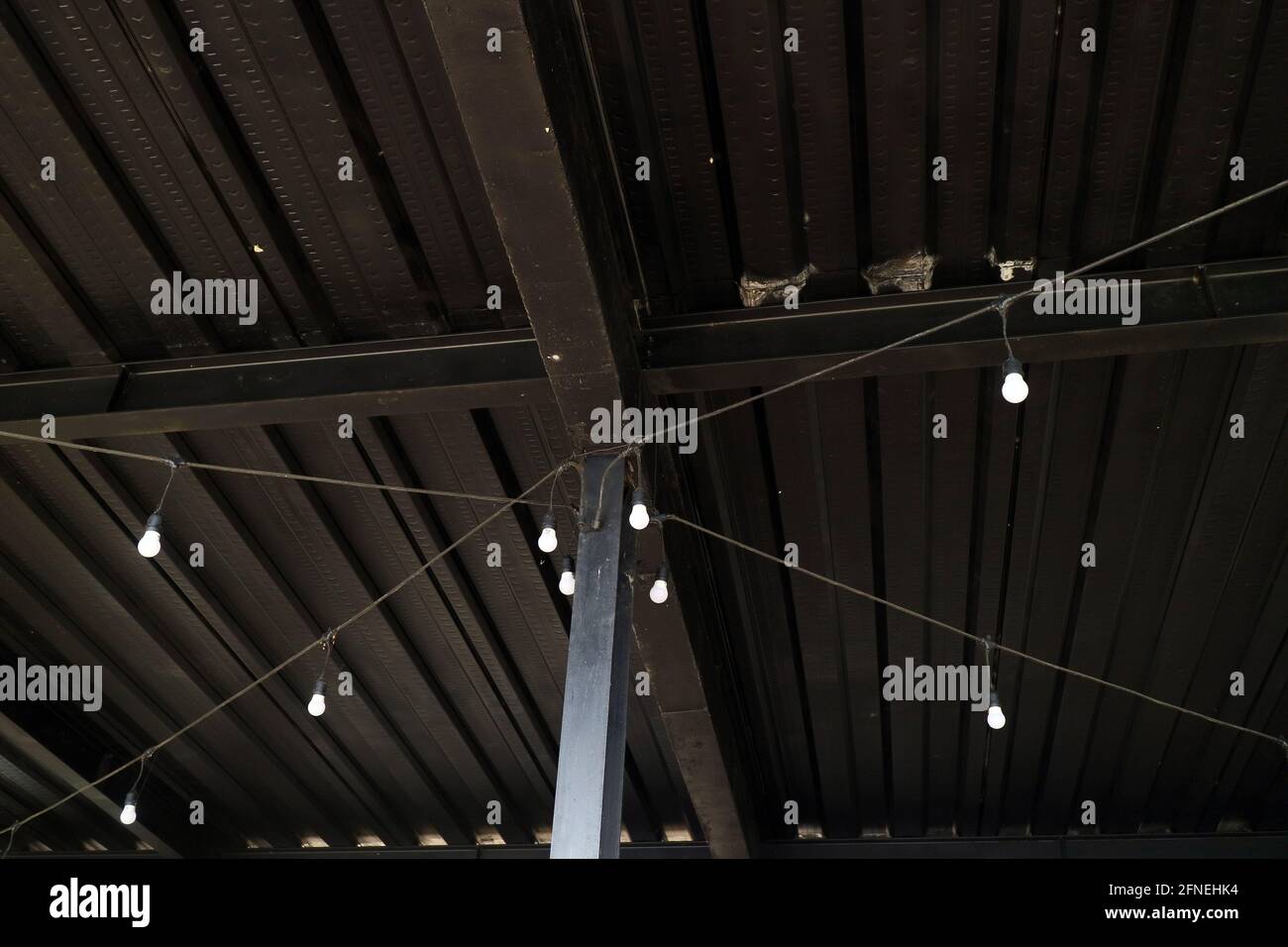 black iron wall with a few lights photo Stock Photo Alamy