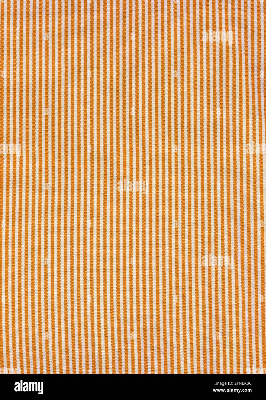 Orange striped tablecloth background texture. Fabric wallpaper Stock Photo