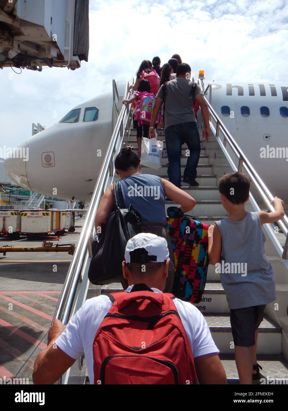 Passengers boarding a jet place in Manila airport Stock Photo