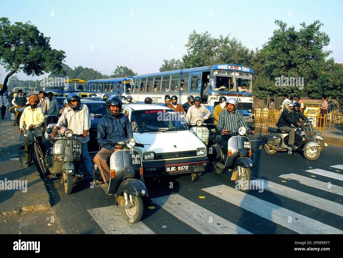 Road Traffic in New Delhi. Although the number of registered motor vehicles is growing steadily, the most popular means of transport is still the two-wheeler, whether motorised, such as the Bahaj scooters built under licence in India, or the bicycle and cycle rickshaw. [automated translation] Stock Photo