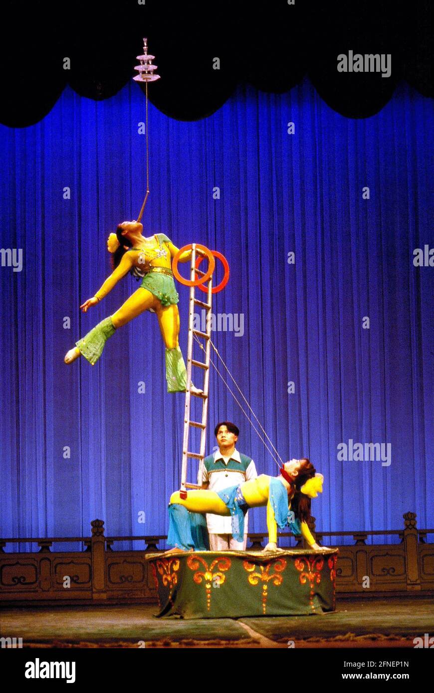 An acrobat in an evening acrobat show in Shanghai. [automated ...