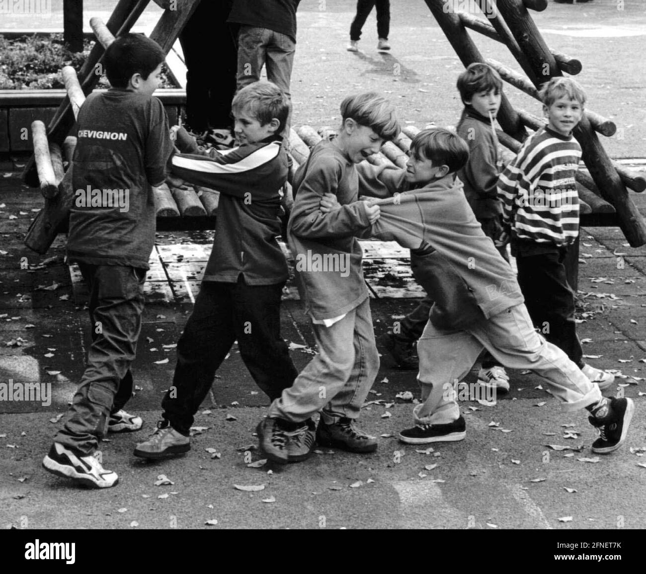 Several pupils in the playground of the Gottlieb-Kinkel primary school in Bonn-Oberkassel are scuffling with each other. [automated translation] Stock Photo