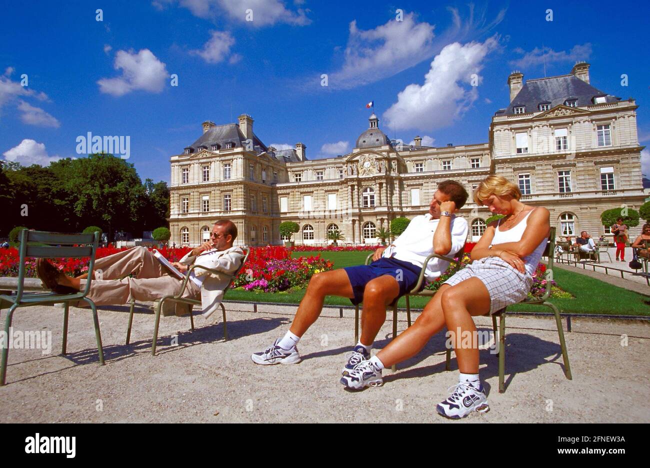 Tourists sunbathe in the garden of the 'Palais du Luxembourg'. The palace  was built as a widow's residence for Henry IV's wife, Maria de Medici. She  wanted the palace to be designed