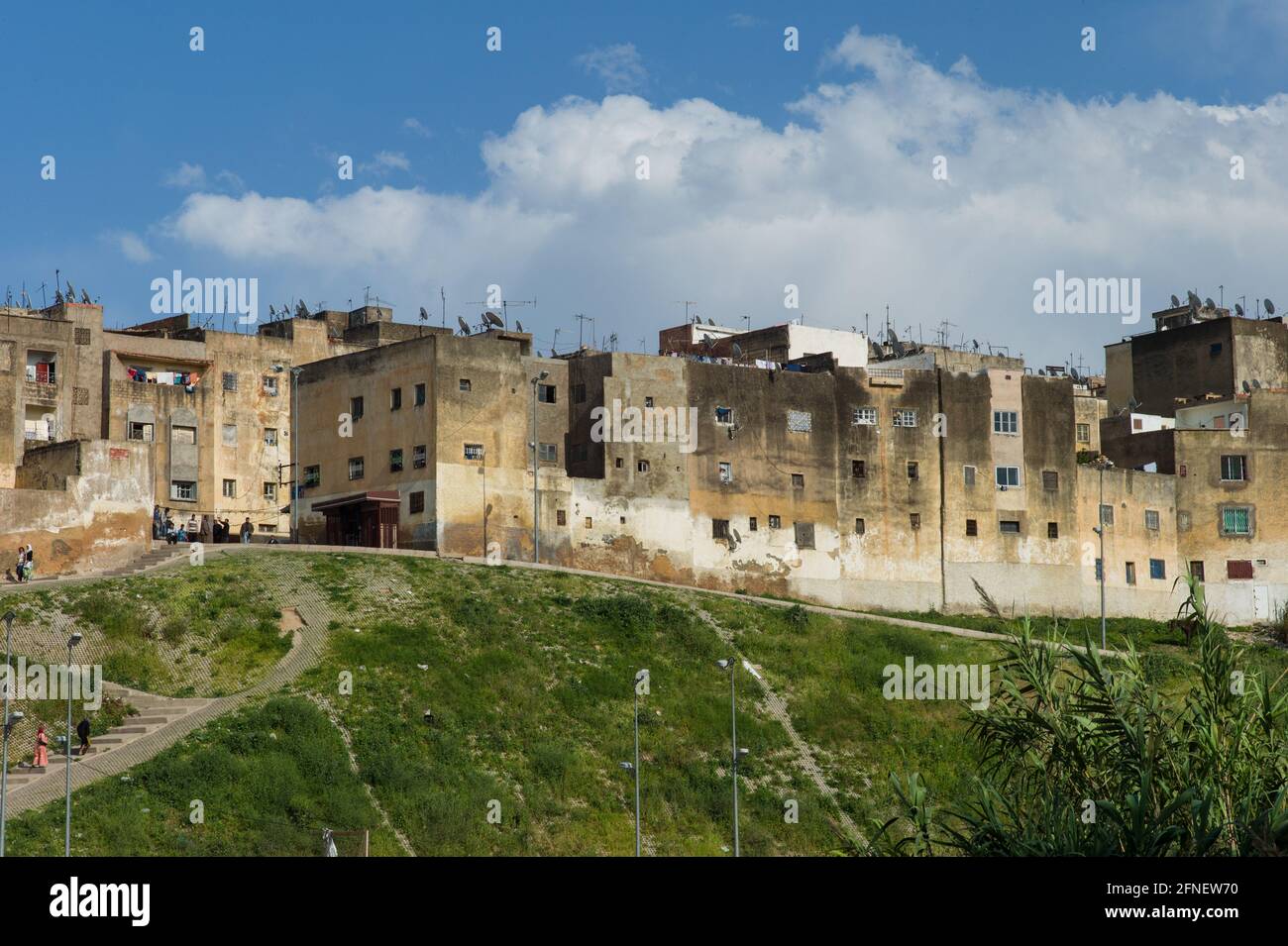 Typical yellow walls of houses with small windows on the edge of the