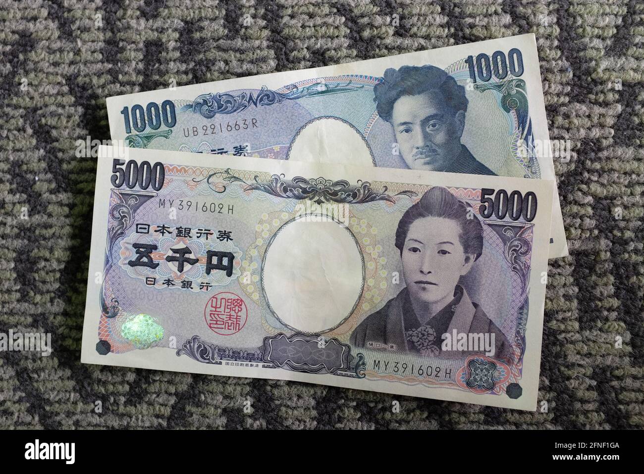 5000 Yen To Rm Thomas Knox little-boy-hispanic-kid-holding-5000-japanese-yen-banknotes-smiling