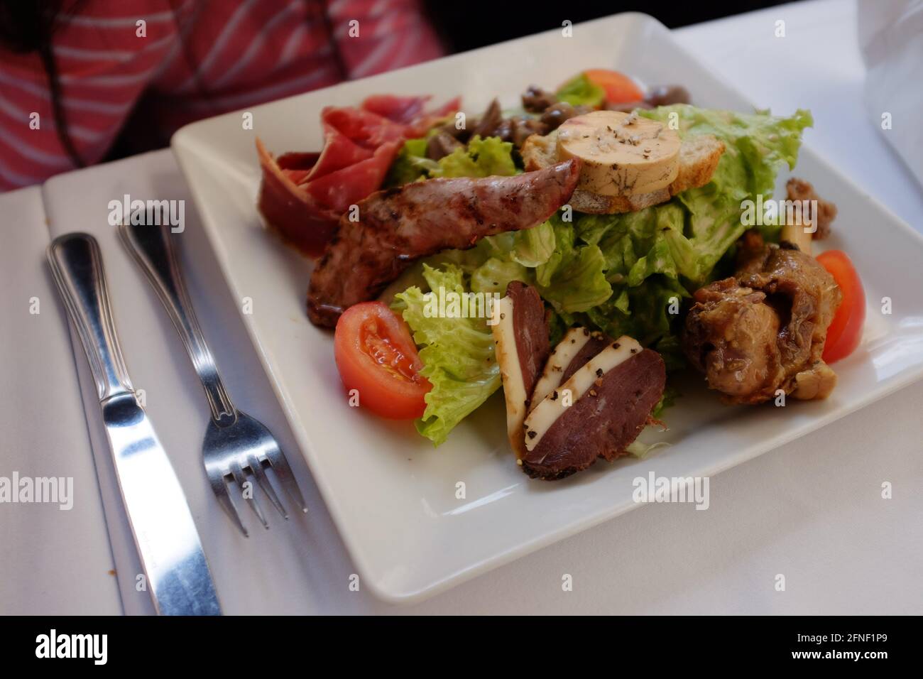 mixed meat salad meal in Toulouse, Haute-Garonne, Occitanie, South of France Stock Photo