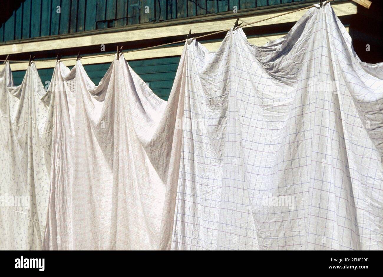Laundry dries on the line in the German rayon Asowo near Omsk in western Siberia. In Siberia, settlements of Russian Germans (Sibiri Germans) began to appear in 1881. [automated translation] Stock Photo