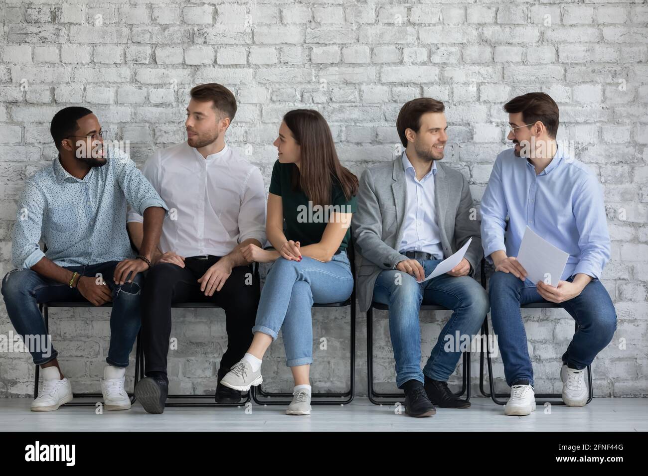 Vacancy applicants talking, discussing employment and hiring Stock Photo