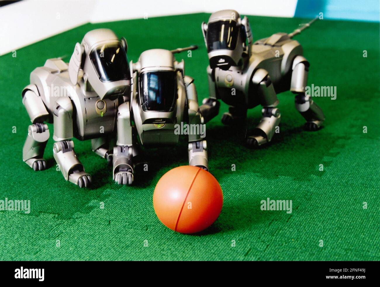 Computer science students at Humboldt-Universität zu Berlin are working on soccer-playing robot dogs from SONY in Berlin-Adlershof. The project leader is Professor Peter Burkhard. The unit price of the original Kicker model, which is only sold in Japan and the USA, is DM 4,000. [automated translation] Stock Photo