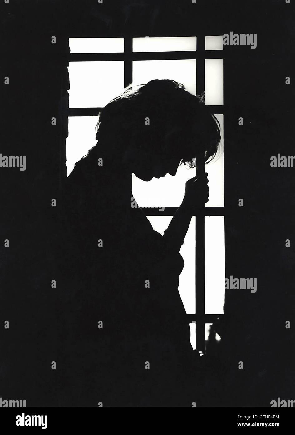 A woman symbolizes sadness and depression through her posture