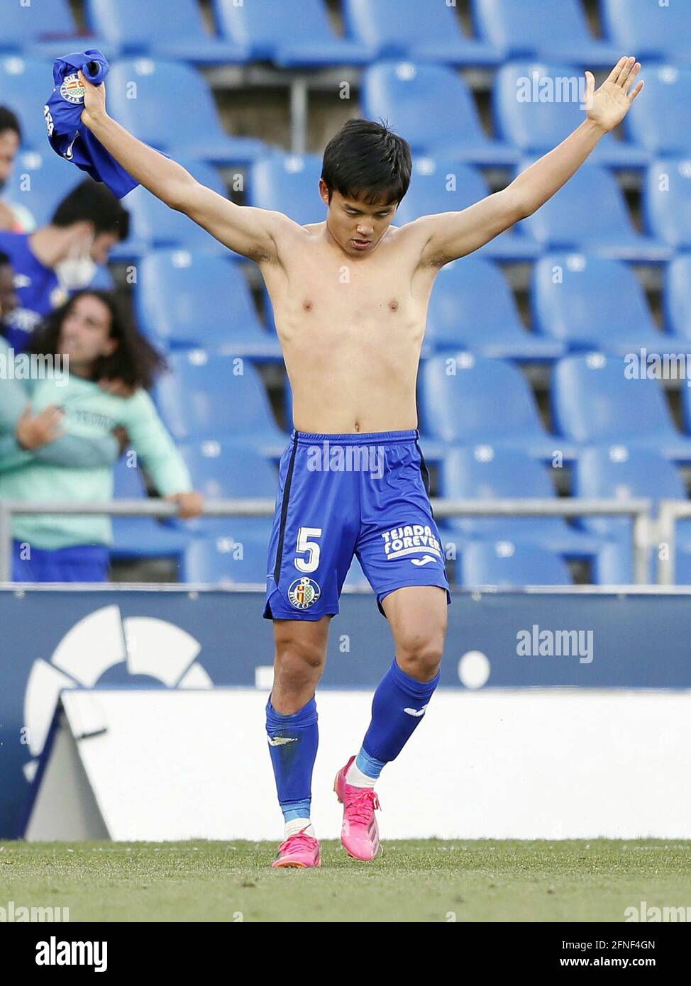 Getafe's Takefusa Kubo takes off his jersey after scoring a goal during the half of La football match against Levante on May 16, 2021, in Getafe, Spain. (Kyodo)==Kyodo Photo