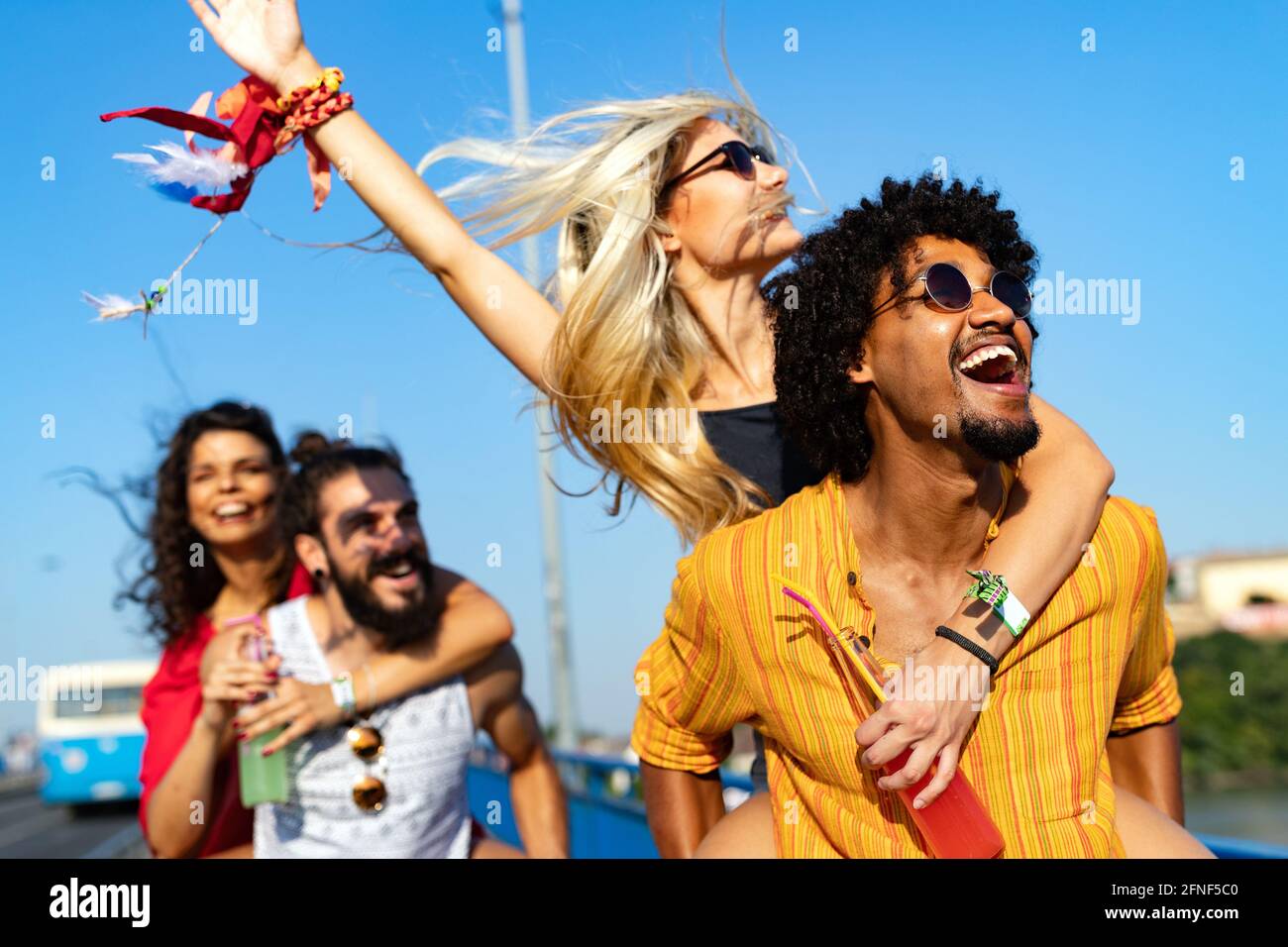 Group of young happy friends enjoying outdoor music festival Stock Photo