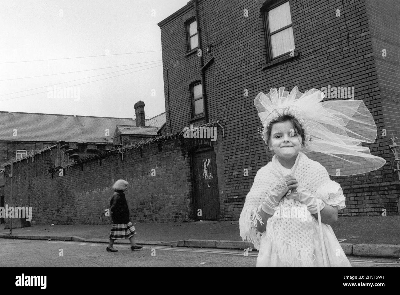 A little girl after her first communion in Belfast. [automated translation] Stock Photo
