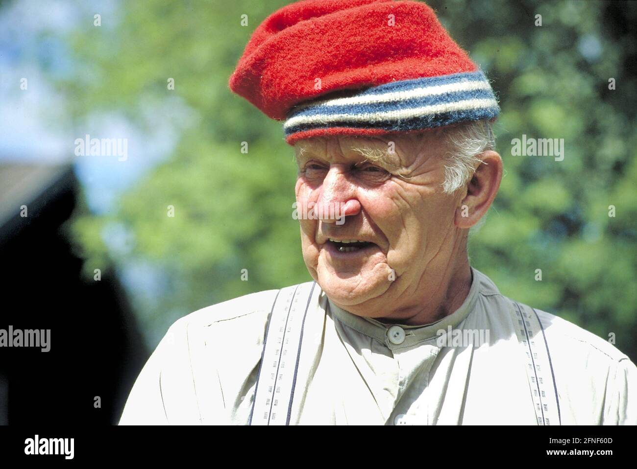 An old farmer wearing a typical Norwegian cap at Maihaugen Open Air Museum. The museum was founded by the dentist Anders Sandvig (1862-1950) and is one of the largest open-air museums in Scandinavia. The museum illustrates traditional Norwegian farming culture. [automated translation] Stock Photo