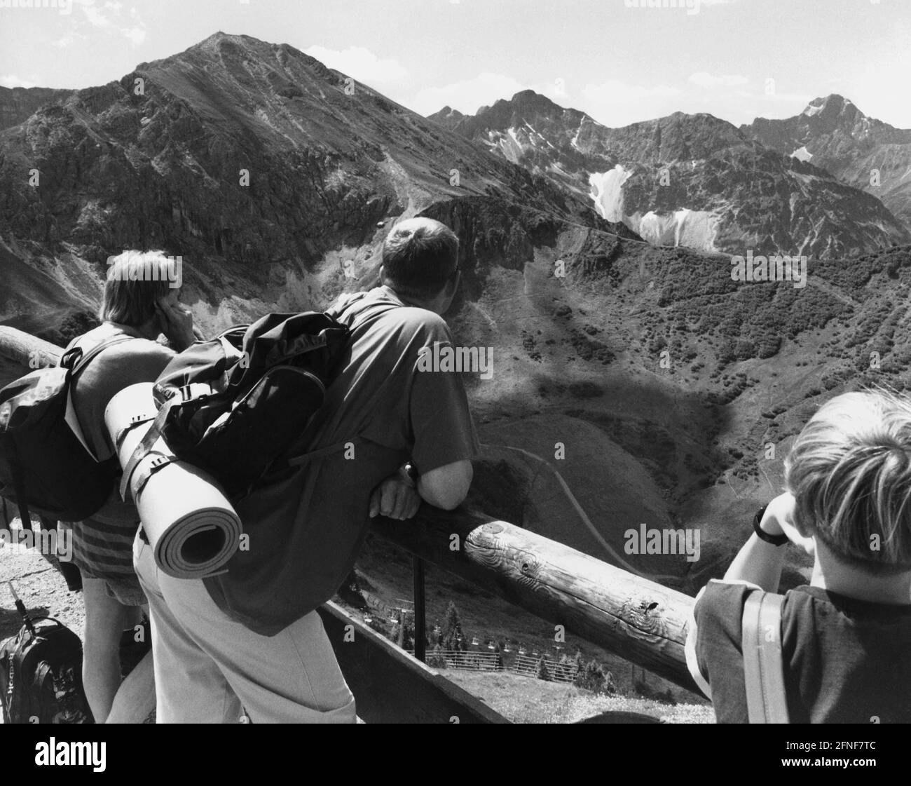 Mountain hikers enjoy the beautiful view to the Kanzelwand in Kleinwalsertal. [automated translation] Stock Photo