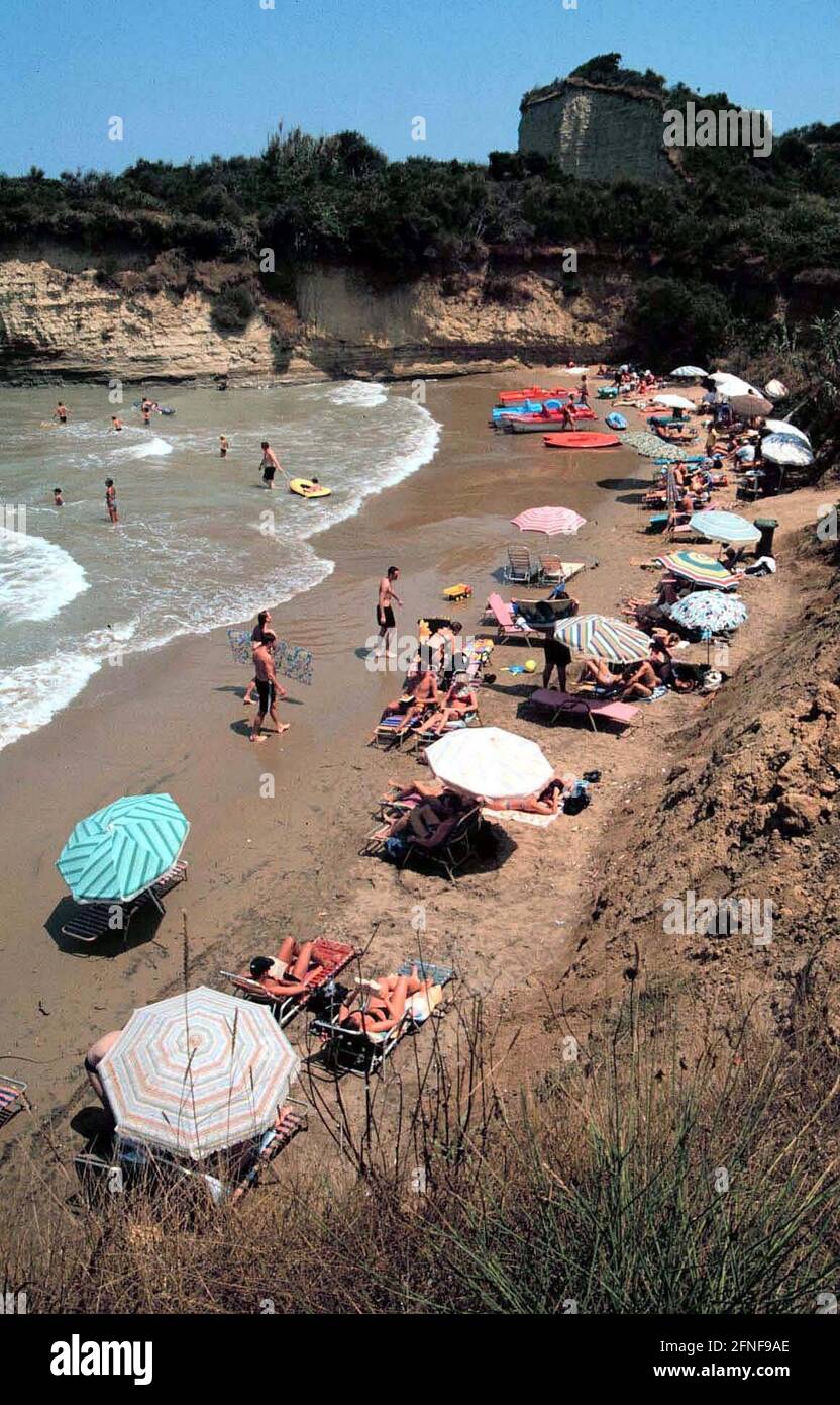 Tourists on the beach on the Greek Mediterranean island of Corfu. [automated translation] Stock Photo