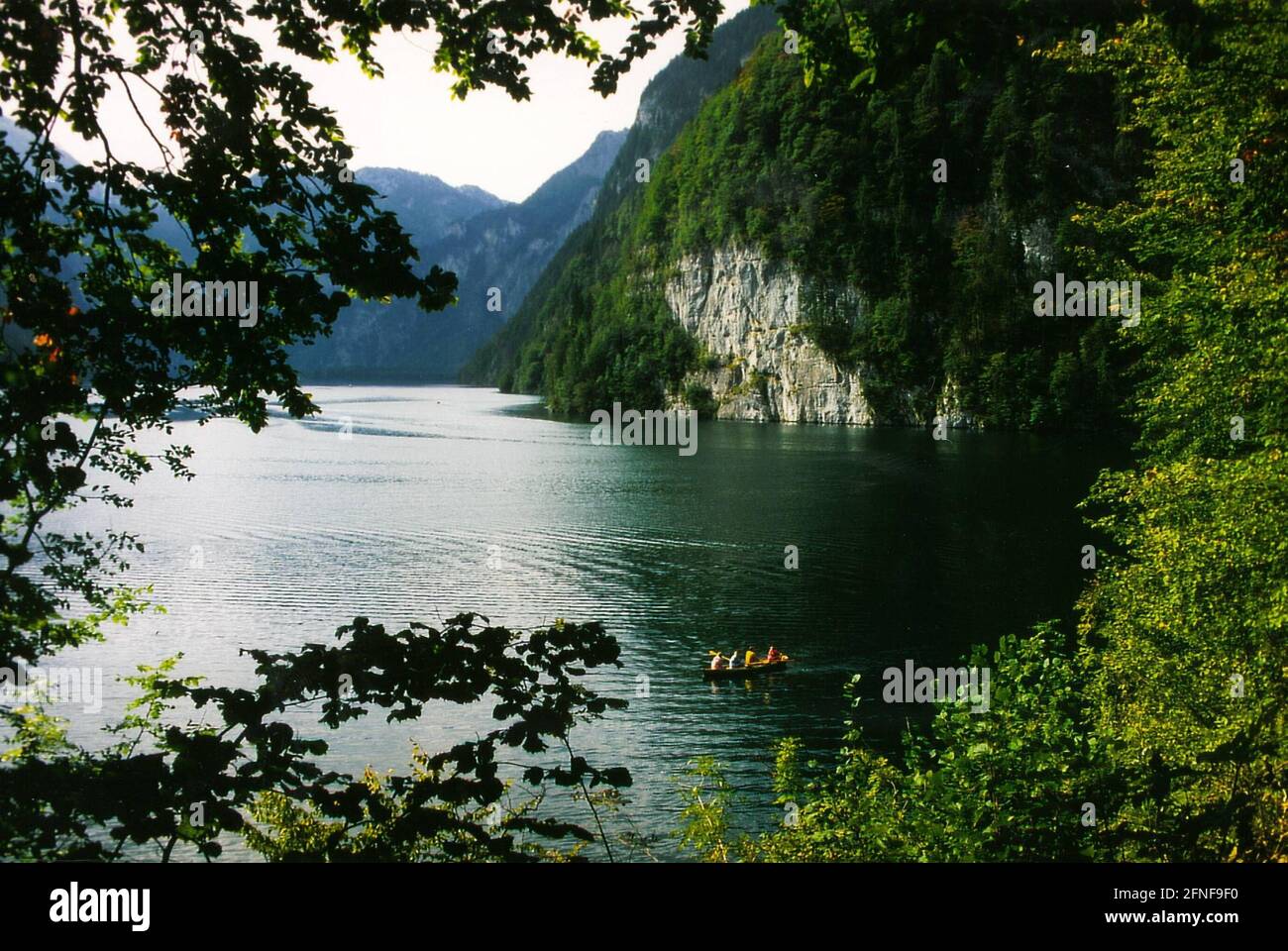 The Königssee is framed by vertical rock faces almost like a fjord. [automated translation] Stock Photo