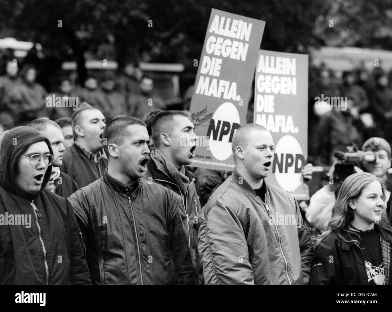 "Participants of a NPD demonstration in Bonn. They hold up placards that read ""Alone against the Mafia. NPD"" [automated translation]" Stock Photo