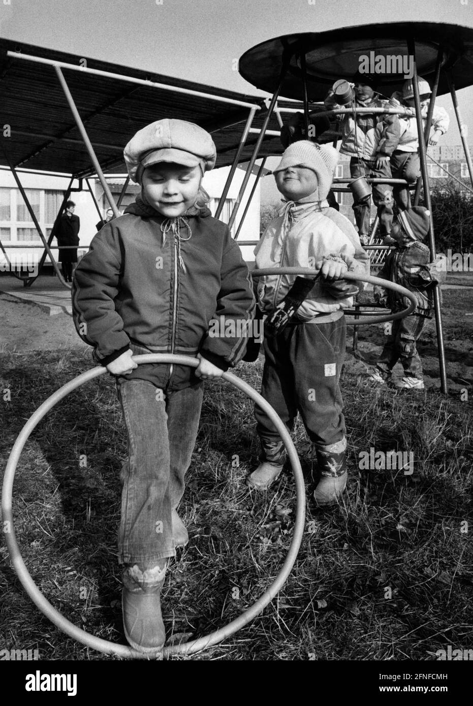 Kids Using Playground Rings Children play with rings on the playground of a Magdeburg kindergarten ...
