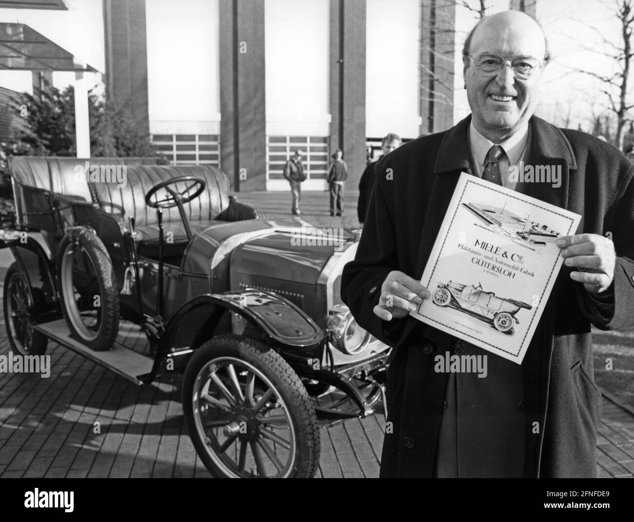 German entrepreneur Rudolf Miele presents one of the cars produced by