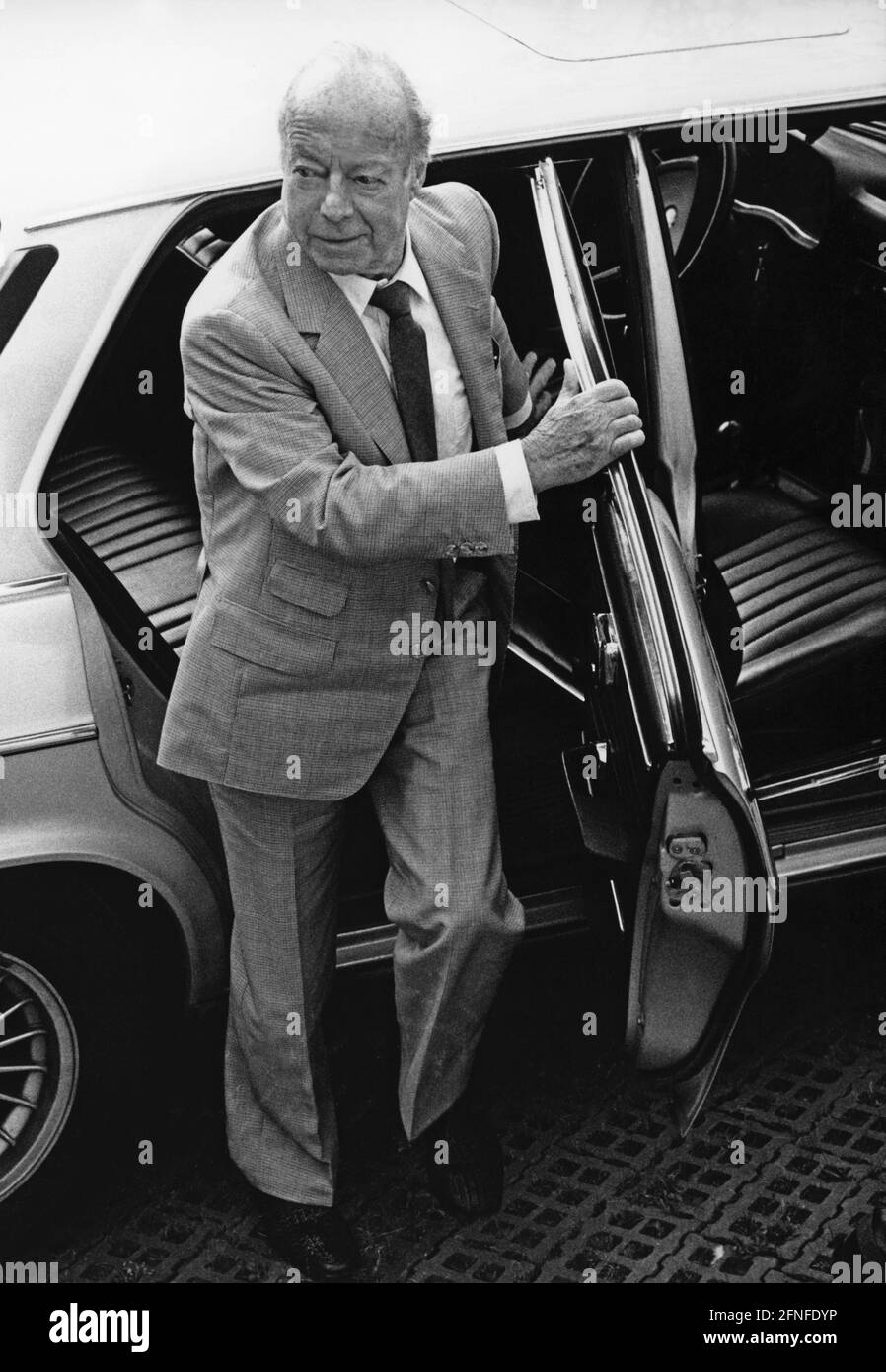 Actor Heinz Rühmann gets out of a car. [automated translation] Stock Photo