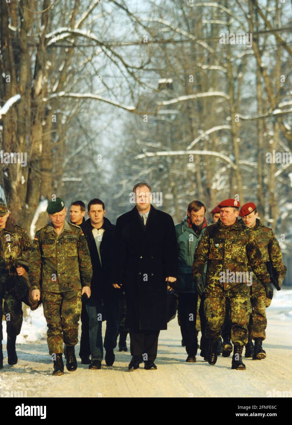 This photograph shows Federal Defence Minister Rudolf Scharping on a winter walk with Bundeswehr soldiers stationed in Sarajevo (Sarajevo). [automated translation] Stock Photo