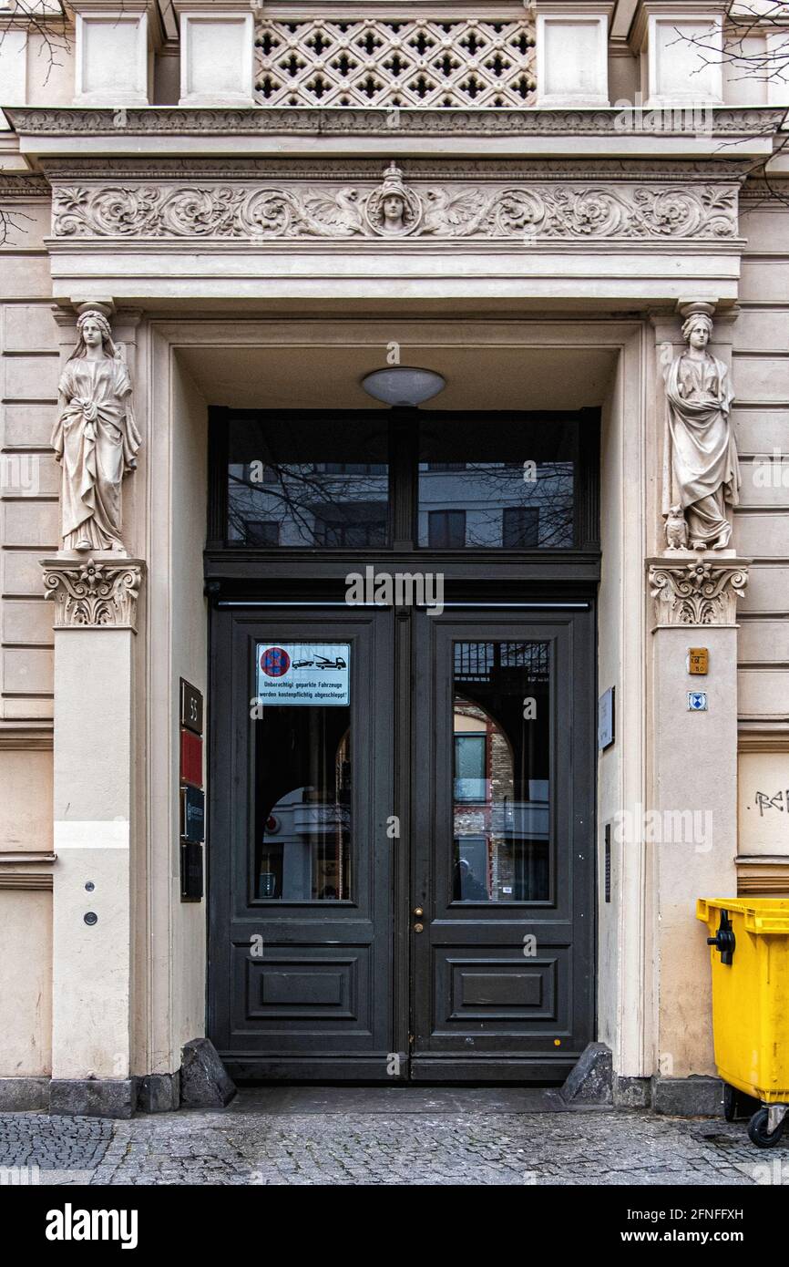 Entrance of apartment building built 1858 with sculptural detailsl. Listed building at Schönhauser Allee 55, Prenzlauer Berg, Berlin Stock Photo
