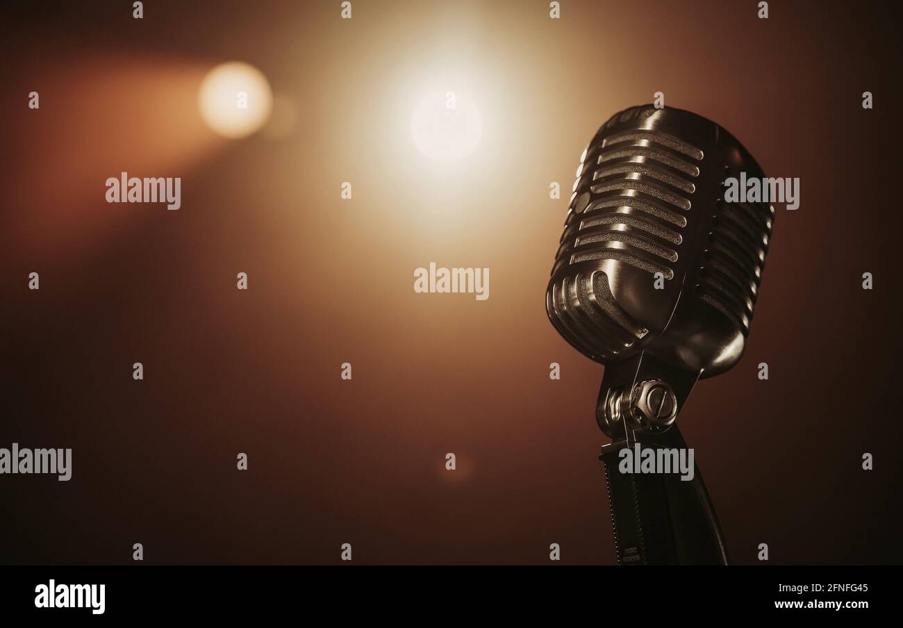 Close up of a retro microphone at the stage with copy space Stock Photo
