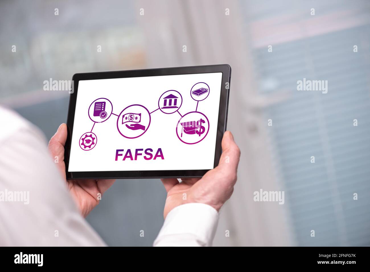 Fafsa concept shown on a tablet held by a man Stock Photo