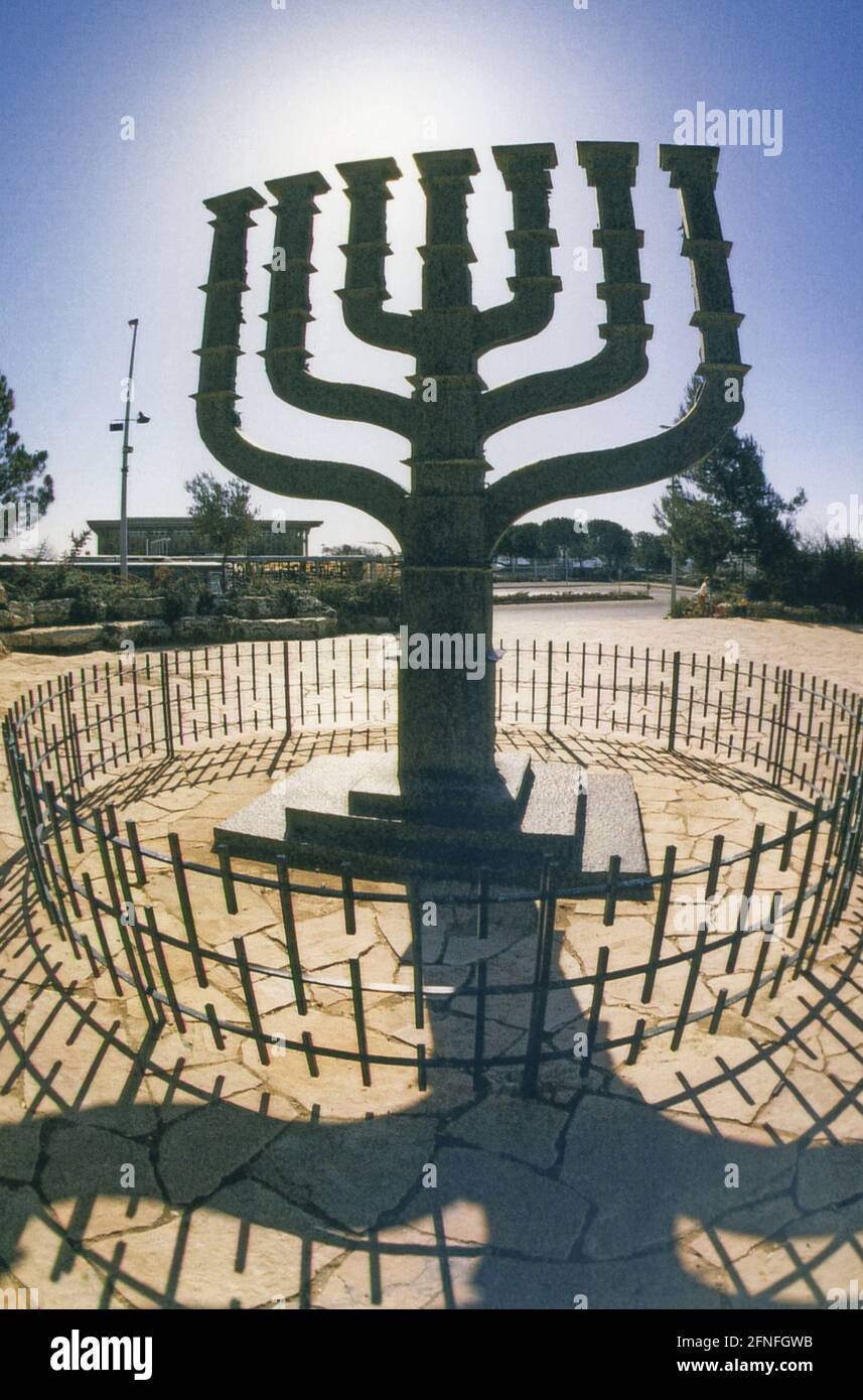 The menorah designed by Benno Elkan in front of the Knesset in Jerusalem. The main work of the German sculptor shows various scenes from the biblical history of the Jewish people and has stood in front of the building complex of the Israeli parliament since 1966. [automated translation] Stock Photo