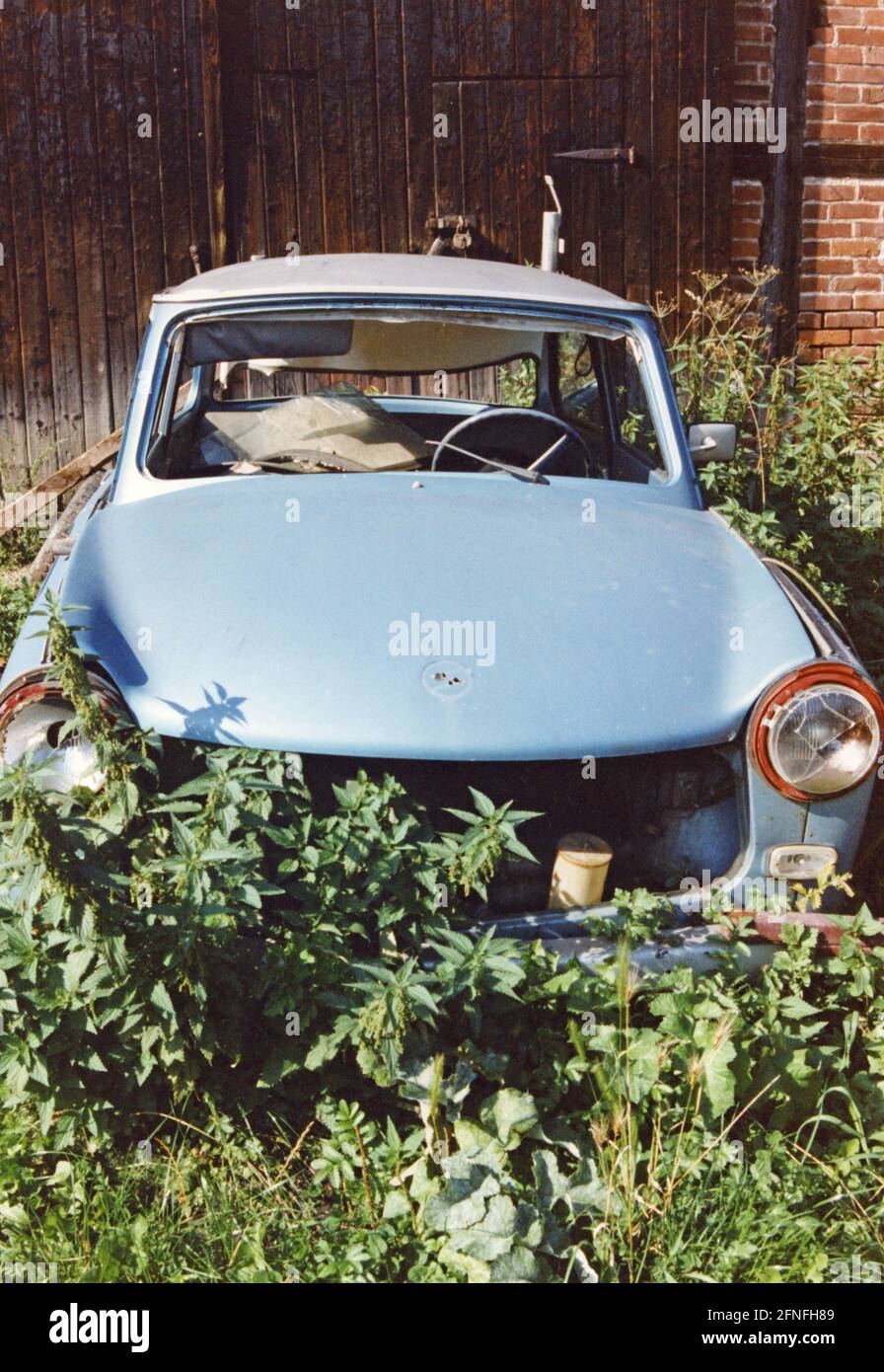A gutted Trabant 601 stands in front of a barn in Eisenach [automated translation] Stock Photo