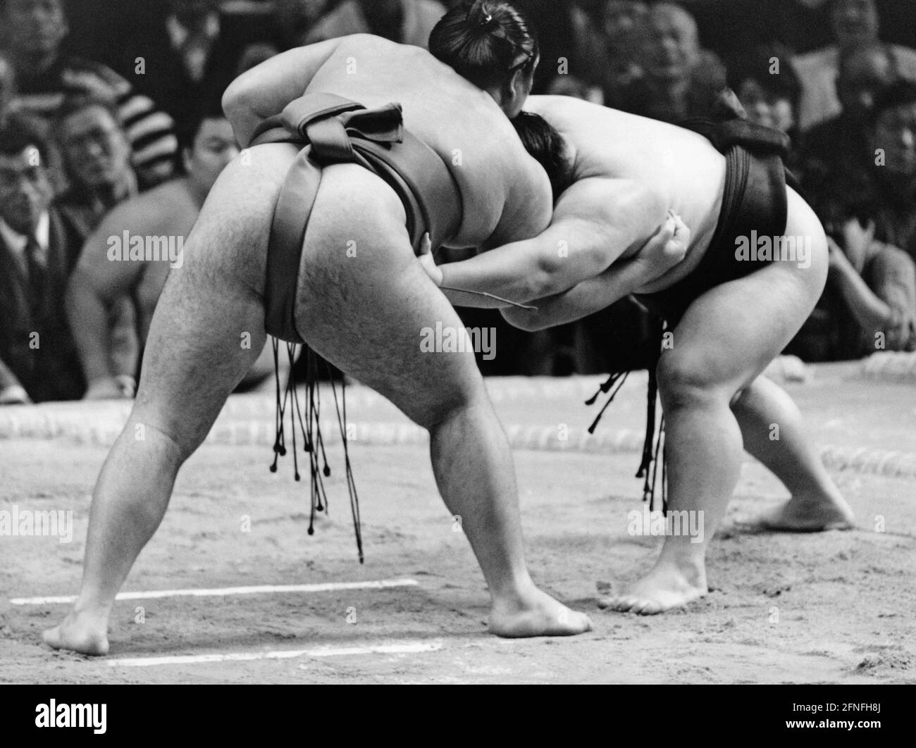 Two sumo wrestlers during a match in Osaka. [automated translation] Stock Photo