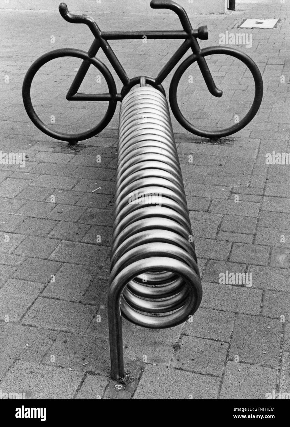 Designer bicycle stand with integrated pseudo-bicycle to illustrate the intended use. [automated translation] Stock Photo