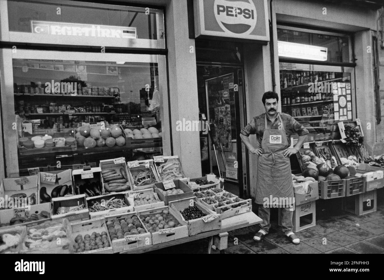 Turkish Shopkeeper A shopkeeper of Turkish origin in front of his shop. [automated ...