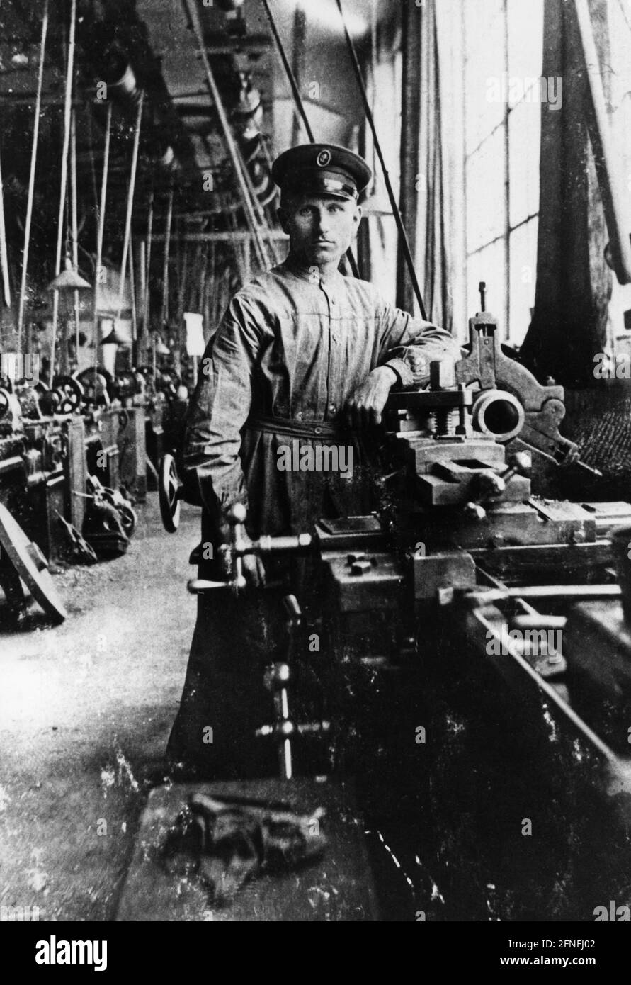 A machinist in a factory. [automated translation] Stock Photo