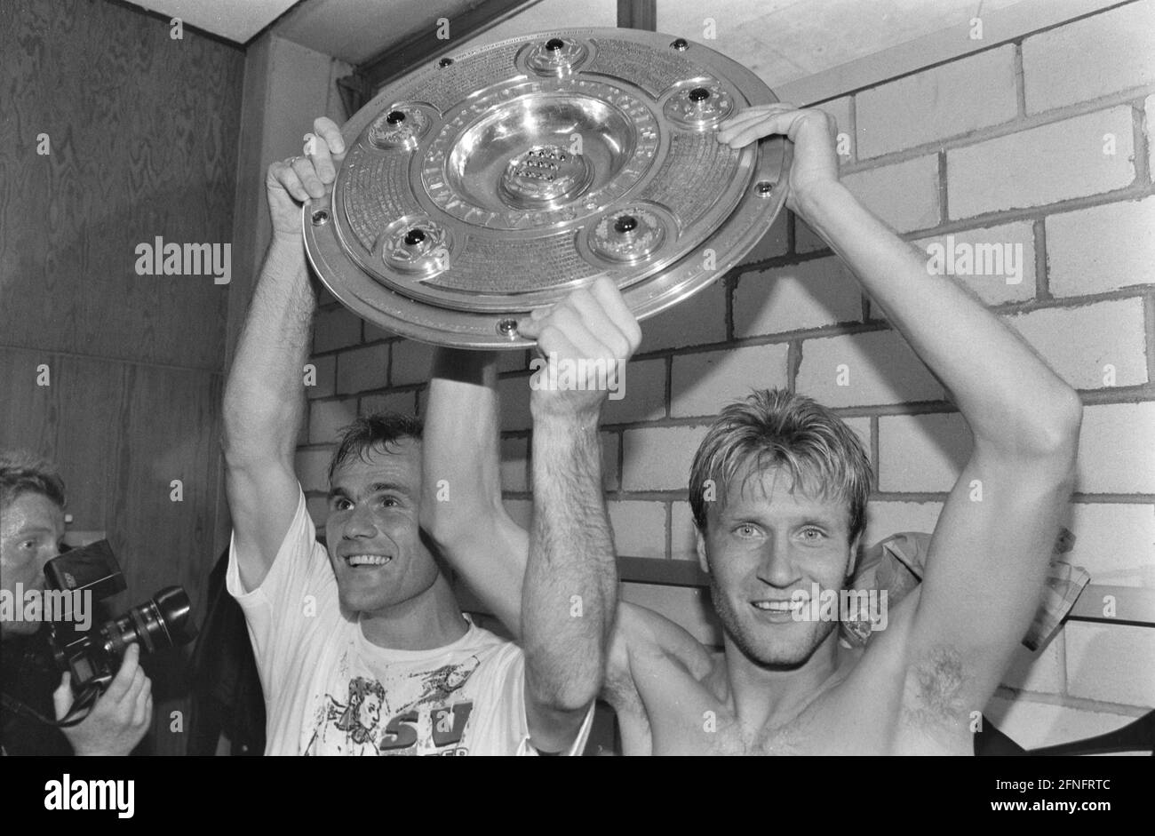 FOOTBALL 1st FEDERAL LEAGUE SEASON 1992/1993 34th Matchday VfB Stuttgart - Werder Bremen 05.06.1993 Bernd Hobsch and Thomas Wolter (from left, both Werder Bremen) celebrate in the dressing room with the championship trophy PHOTO: WEREK Pressebildagentur xxNOxMODELxRELEASExx [automated translation] Stock Photo
