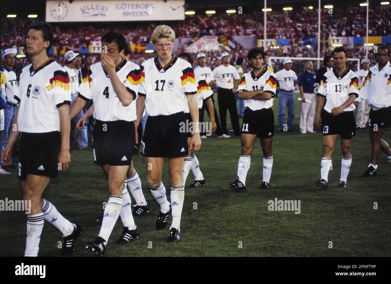 FUSSBALL European Championship 1992 Denmark - Germany Final 26.06.1992 Disappointment Germany: Guido BUCHWALD, Juergen KOHLER, Stefan EFFENBERG, Karl-Heinz RIEDLE, Andreas THOM (flnr all Germany) leave the field disappointed. PHOTO: WEREK Press Photo Agency xxNOxMODELxRELEASExx [automated translation] Stock Photo