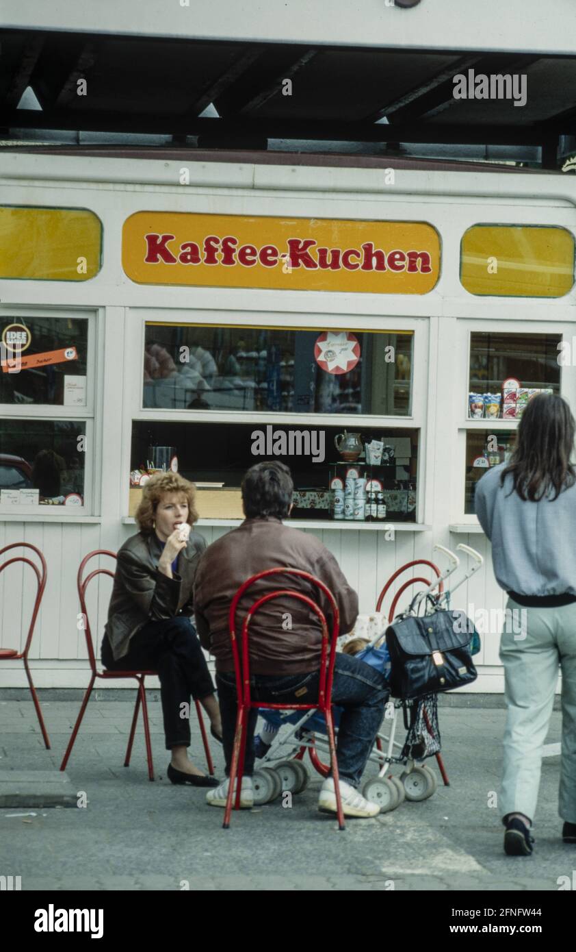 Street café with coffee and cake in a container on Alexanderplatz in