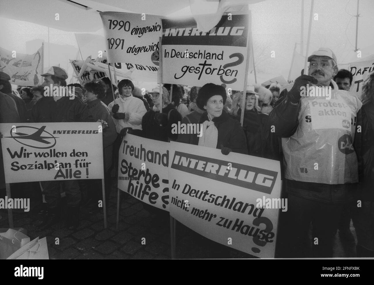 Berlin-Mitte / Alexanderplatz / 1991 Demonstration against the Treuhand agency at Alexanderplatz 6. Employees of the GDR airline Interflug protest against the end of operations. The sign reads -Treuhand Sterbehilfe- // Demo / Treuhandanstalt / Liquidation [automated translation] Stock Photo